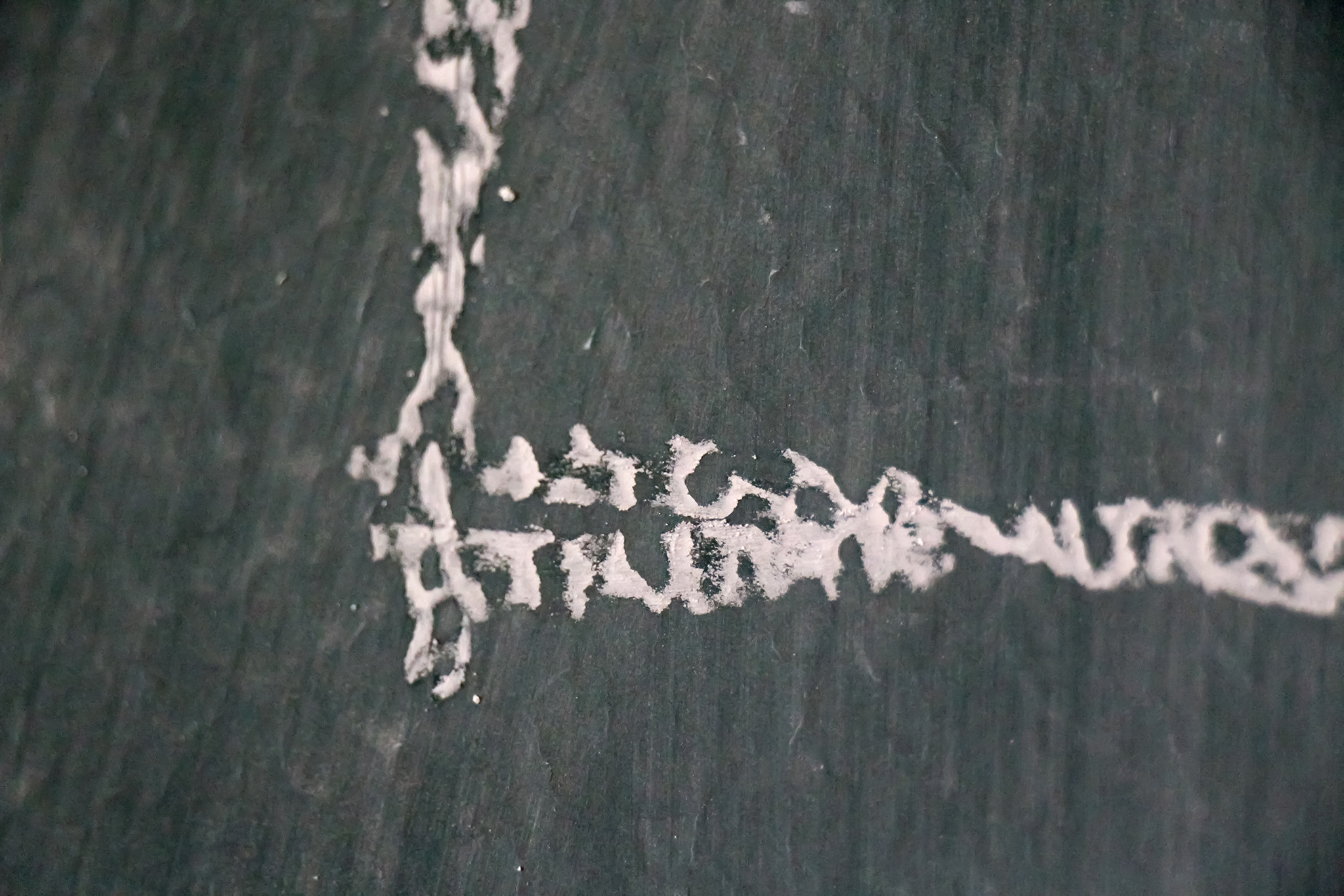 A closeup image of chalk on a blackboard.