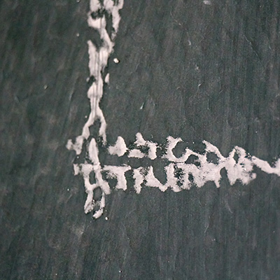 A closeup image of chalk on a blackboard.